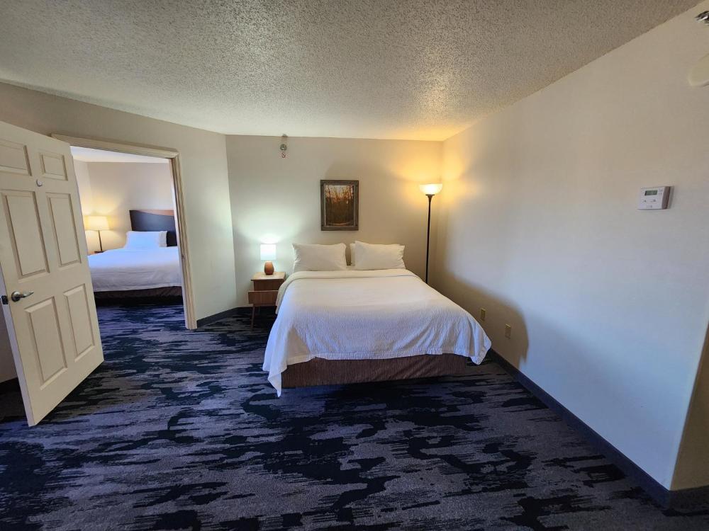 One-Bedroom Family Suite with Two Queen Beds and Sofa Bed interior